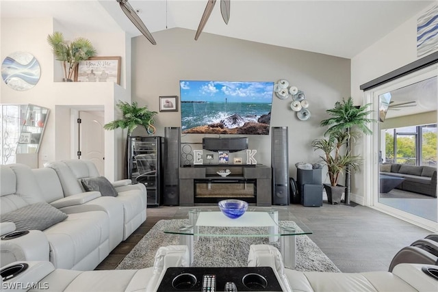 living room with beam ceiling, ceiling fan, wine cooler, high vaulted ceiling, and hardwood / wood-style flooring