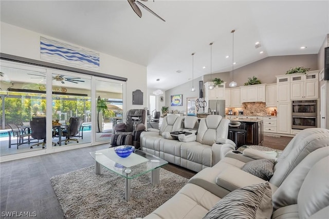 living room featuring ceiling fan and vaulted ceiling