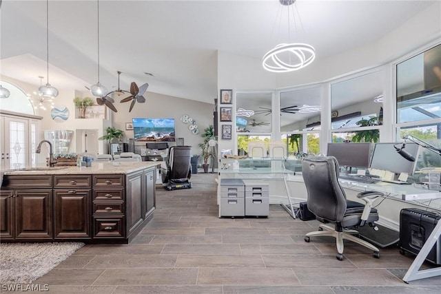 office featuring sink, french doors, light hardwood / wood-style flooring, high vaulted ceiling, and ceiling fan with notable chandelier