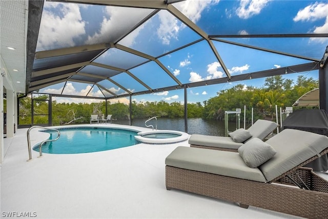 view of pool with glass enclosure, an in ground hot tub, a water view, and a patio