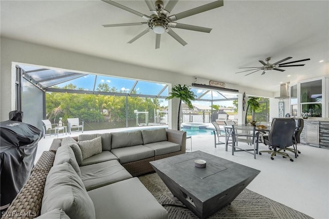 interior space featuring ceiling fan, plenty of natural light, and a swimming pool