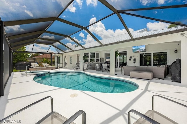 view of swimming pool featuring outdoor lounge area, glass enclosure, and a patio area