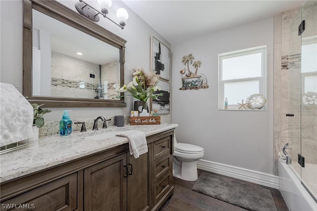 bathroom with wood-type flooring, vanity, and toilet