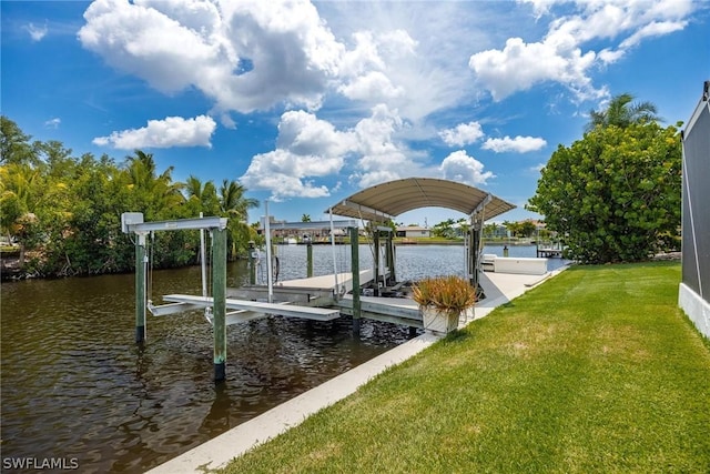 dock area featuring a lawn and a water view