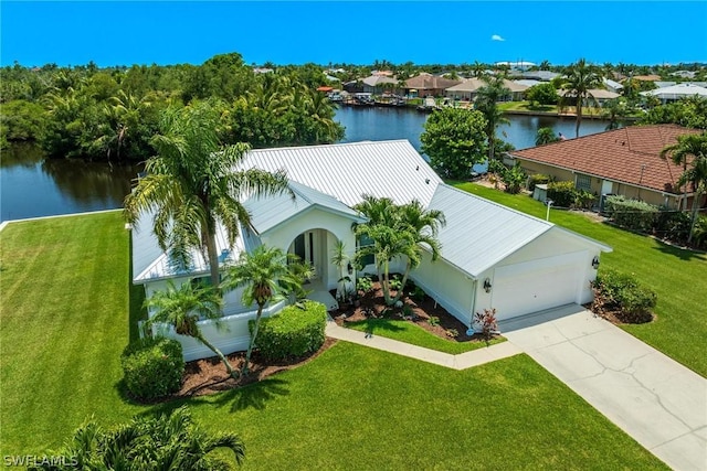 birds eye view of property with a water view