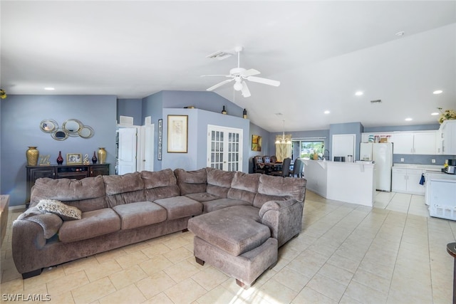 living room featuring ceiling fan, lofted ceiling, and light tile floors