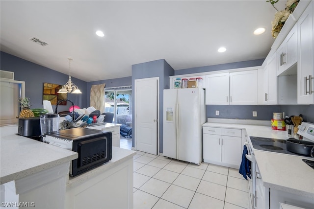 kitchen with decorative light fixtures, an inviting chandelier, light tile flooring, white cabinets, and white appliances