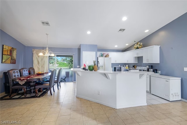 kitchen with light tile flooring, white fridge with ice dispenser, a center island with sink, white cabinetry, and lofted ceiling