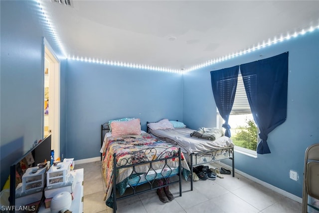 bedroom with tile floors