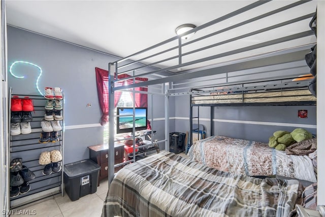 bedroom with light tile floors