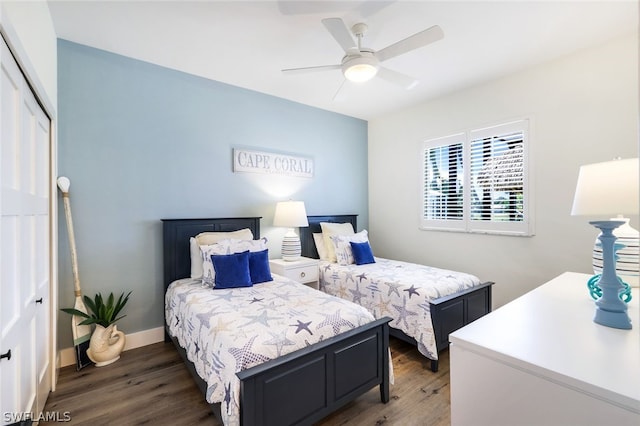 bedroom with ceiling fan, a closet, and hardwood / wood-style flooring