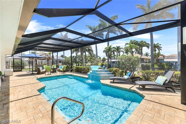 view of swimming pool featuring a patio, glass enclosure, and pool water feature