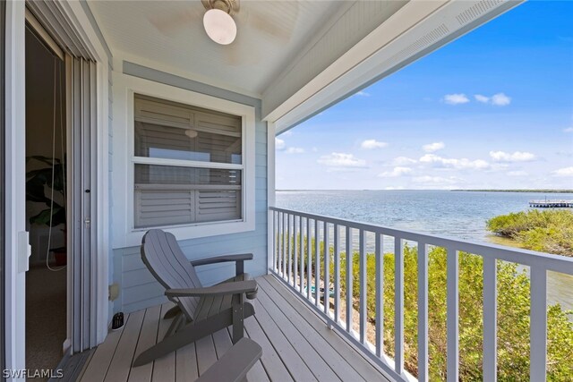 balcony featuring a water view