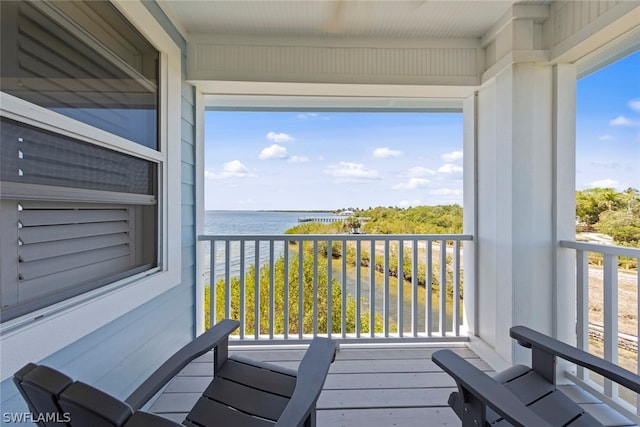 balcony featuring a water view