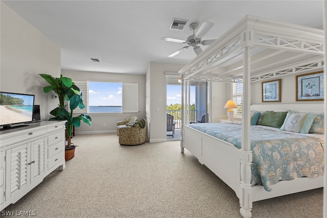 bedroom featuring ceiling fan, light colored carpet, and access to exterior