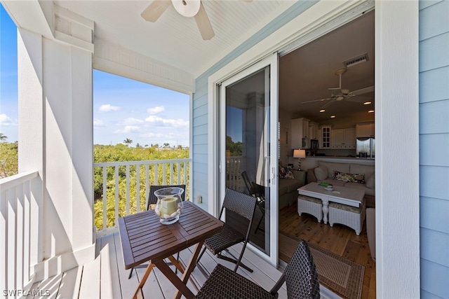 balcony featuring ceiling fan