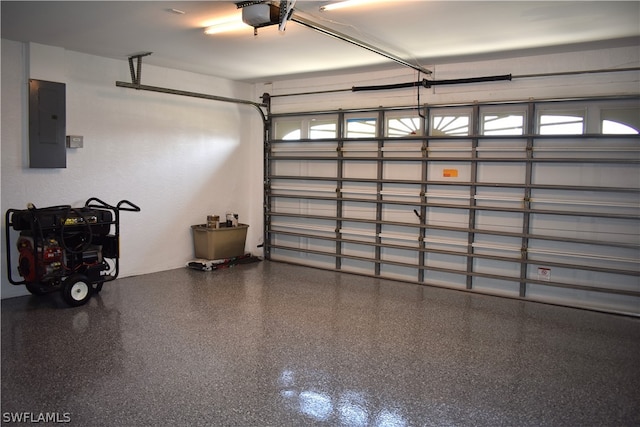 garage featuring a garage door opener and electric panel