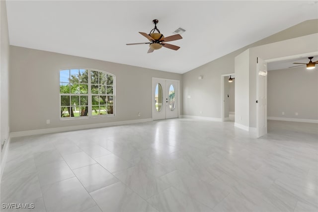 unfurnished room featuring lofted ceiling, french doors, and ceiling fan