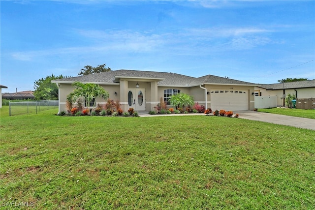 ranch-style home with a front yard and a garage