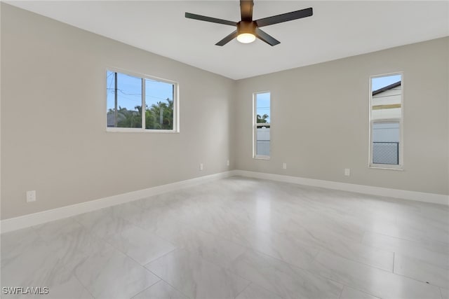 spare room with ceiling fan