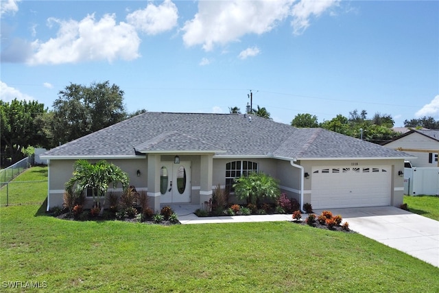 single story home featuring a front yard and a garage