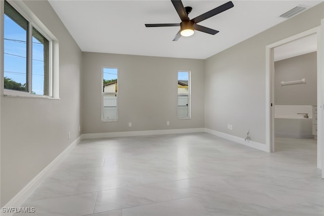 empty room featuring ceiling fan