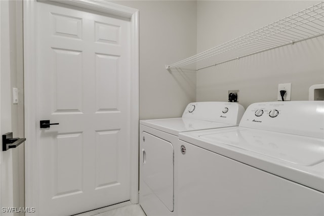 washroom with separate washer and dryer