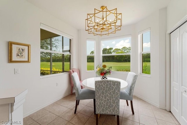 sunroom / solarium with a notable chandelier