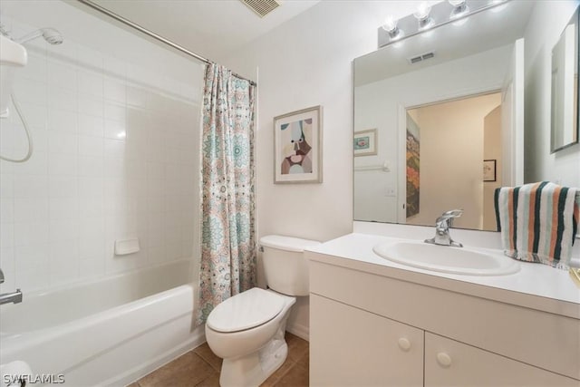 full bathroom with vanity, shower / bath combination with curtain, tile patterned floors, and toilet