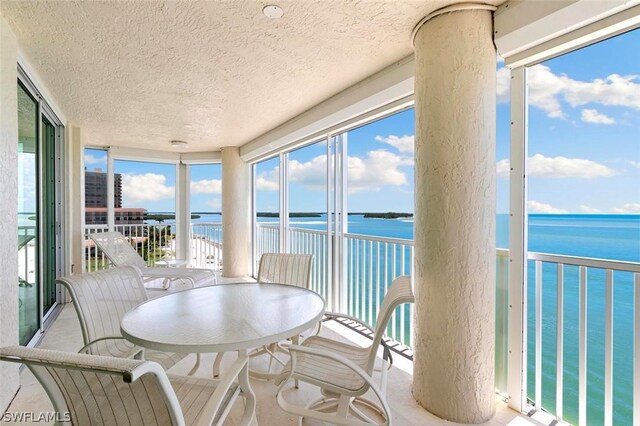 sunroom with a water view