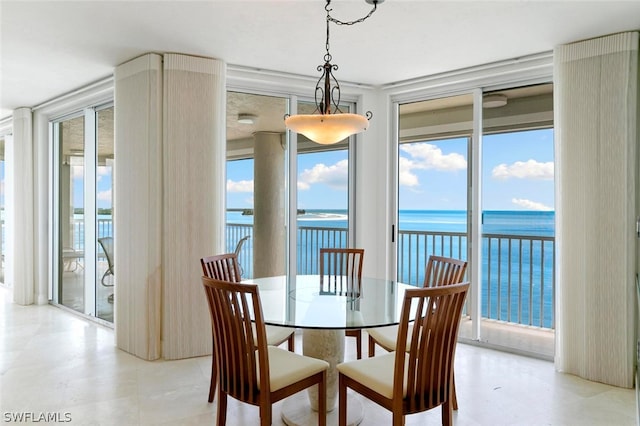 dining area featuring a water view