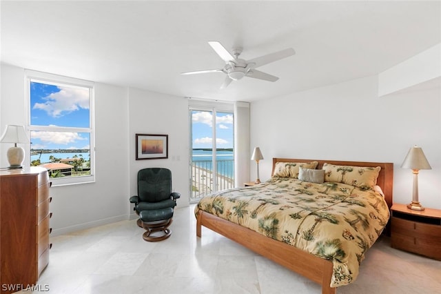 tiled bedroom with multiple windows, a water view, ceiling fan, and access to outside