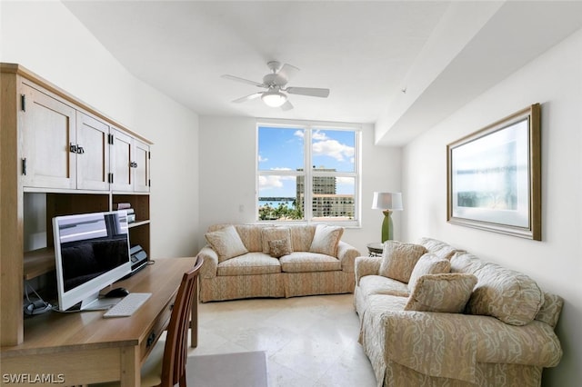 tiled living room with ceiling fan