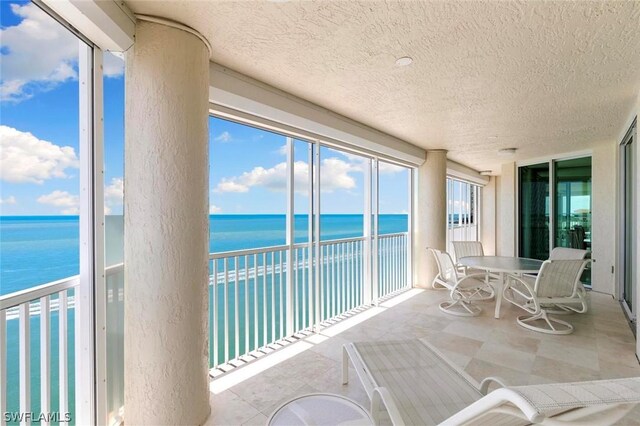 sunroom with a water view