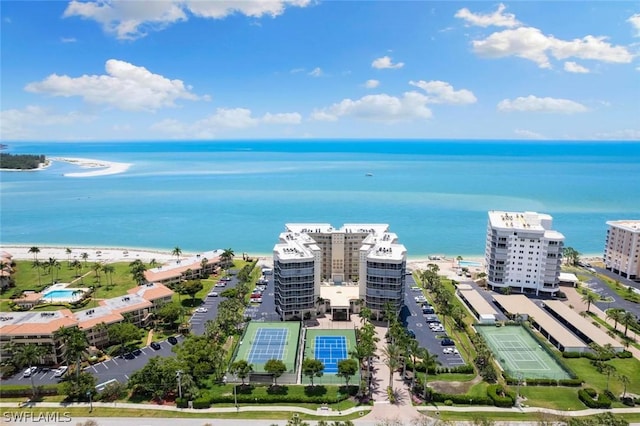 aerial view with a water view and a view of the beach