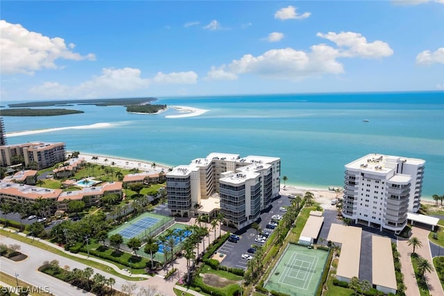 bird's eye view with a water view and a beach view