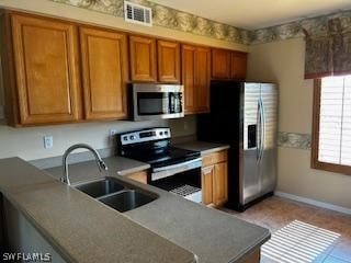 kitchen featuring appliances with stainless steel finishes and sink