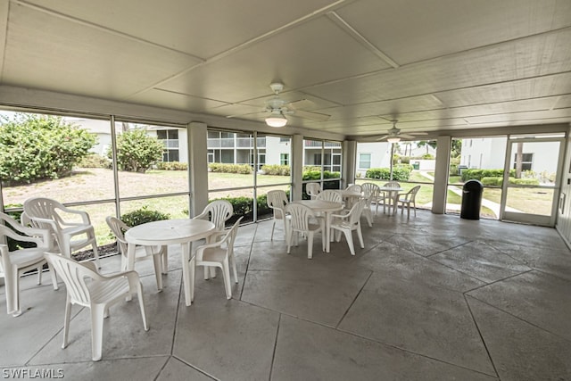 sunroom with plenty of natural light and ceiling fan