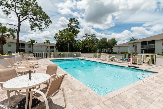 view of swimming pool featuring a patio