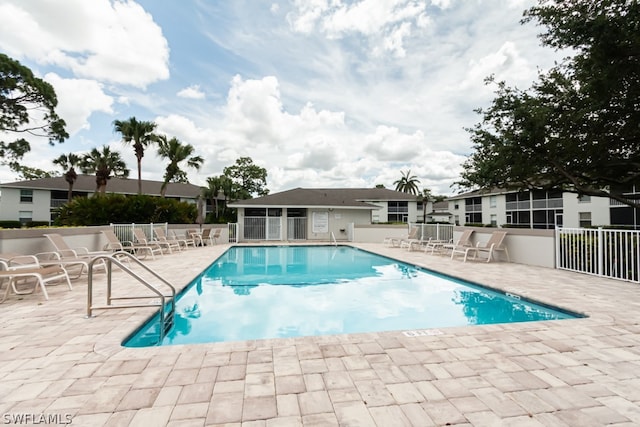 view of swimming pool featuring a patio area