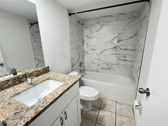 full bathroom featuring tile patterned flooring, toilet, tiled shower / bath combo, and vanity