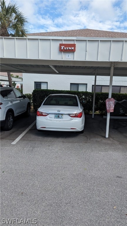 view of vehicle parking featuring a carport