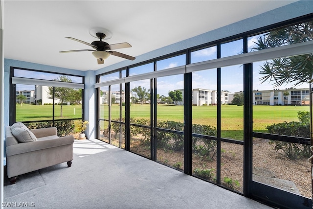 sunroom / solarium with ceiling fan