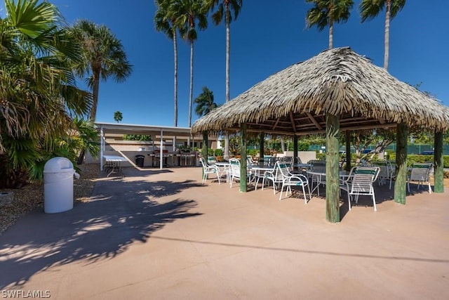 view of property's community with a gazebo and a patio