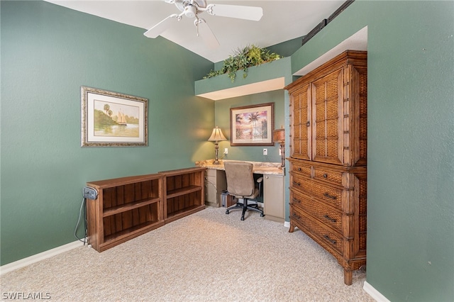 carpeted home office featuring ceiling fan