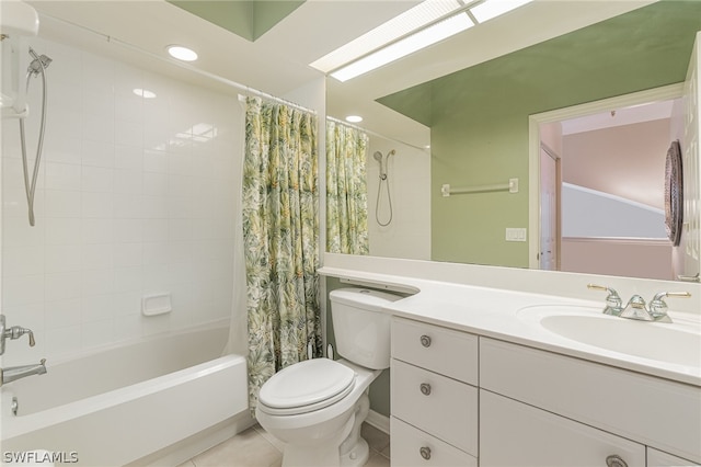 full bathroom featuring shower / bath combo with shower curtain, toilet, vanity with extensive cabinet space, and tile floors