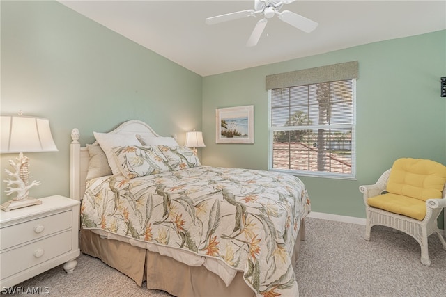 bedroom featuring light carpet and ceiling fan