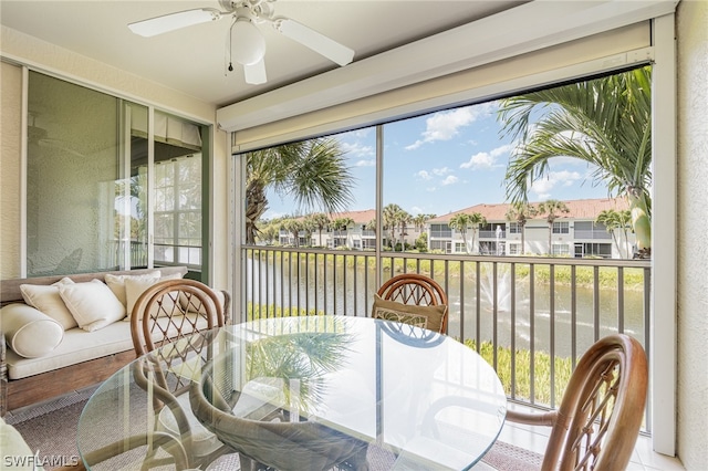 sunroom featuring ceiling fan