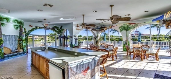 view of terrace featuring ceiling fan