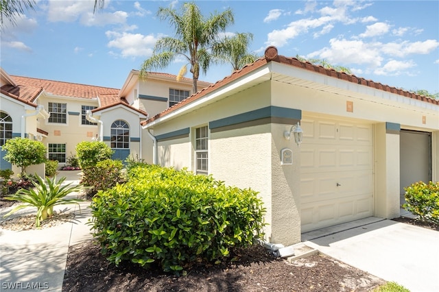 view of side of home with a garage